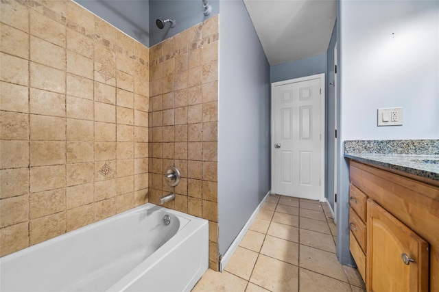 bathroom with vanity, tile patterned floors, and tiled shower / bath