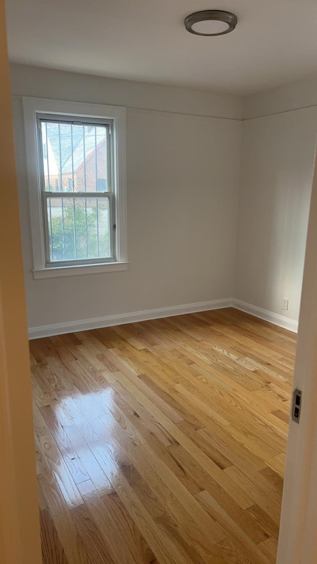 empty room with light wood-type flooring