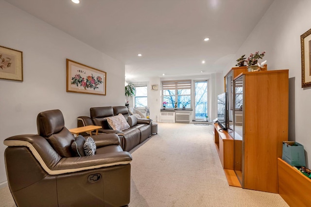 carpeted living room featuring radiator