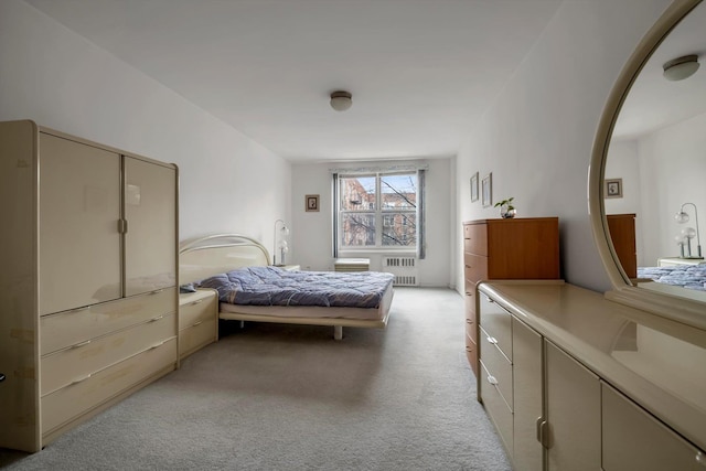 carpeted bedroom with radiator