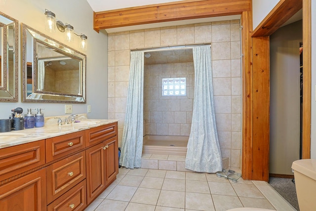 bathroom featuring toilet, vanity, a shower with shower curtain, beamed ceiling, and tile patterned flooring