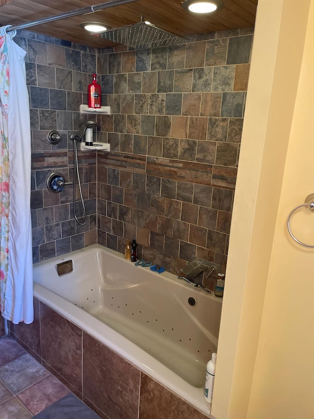 bathroom featuring shower / tub combo with curtain and tile patterned floors