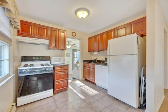 kitchen with sink, white appliances, plenty of natural light, and ceiling fan