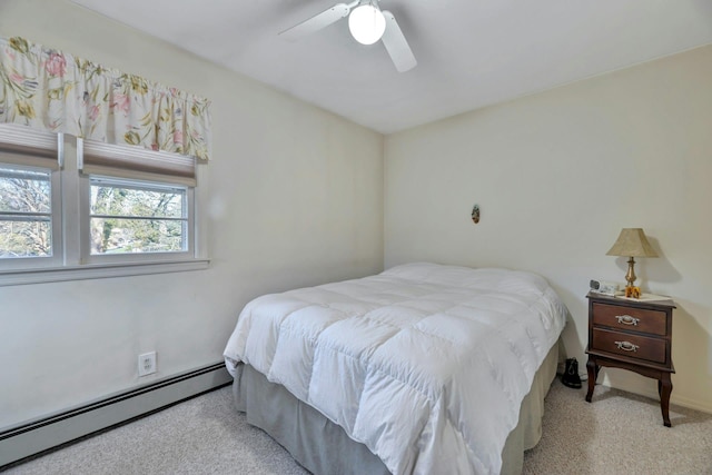 bedroom featuring ceiling fan, light colored carpet, and a baseboard radiator