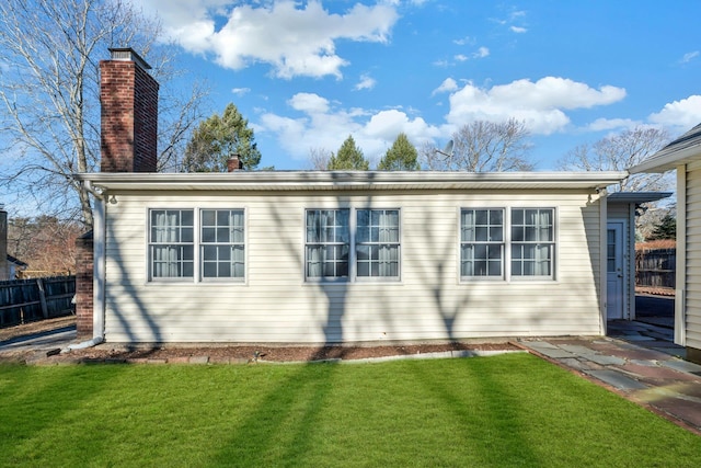 view of home's exterior with a lawn