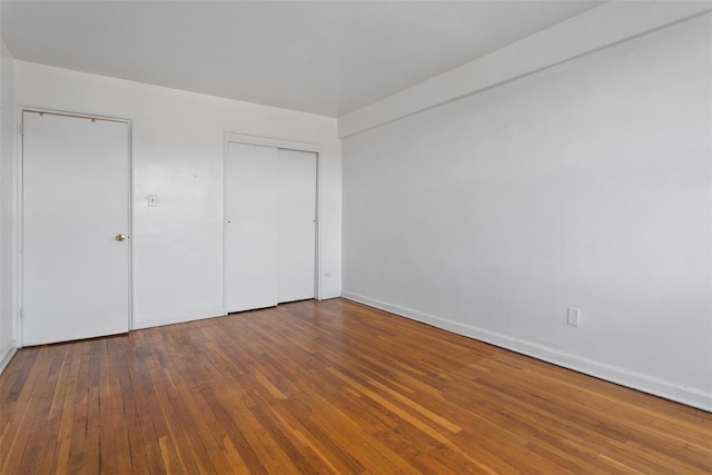 unfurnished bedroom featuring wood-type flooring