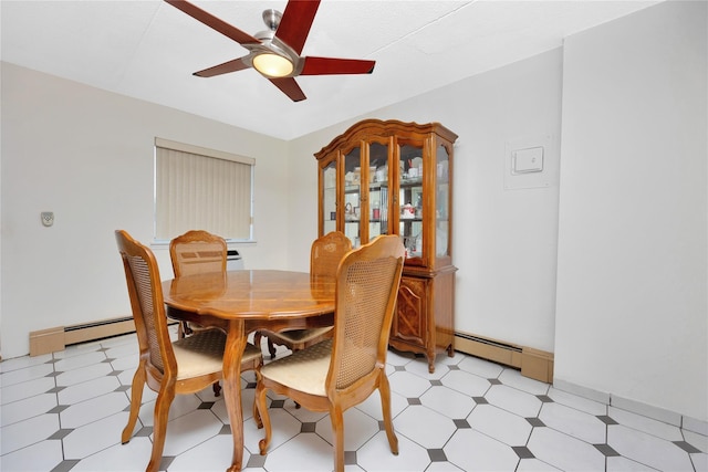 dining room with baseboard heating and ceiling fan