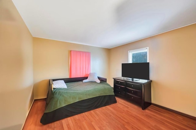 bedroom featuring hardwood / wood-style flooring