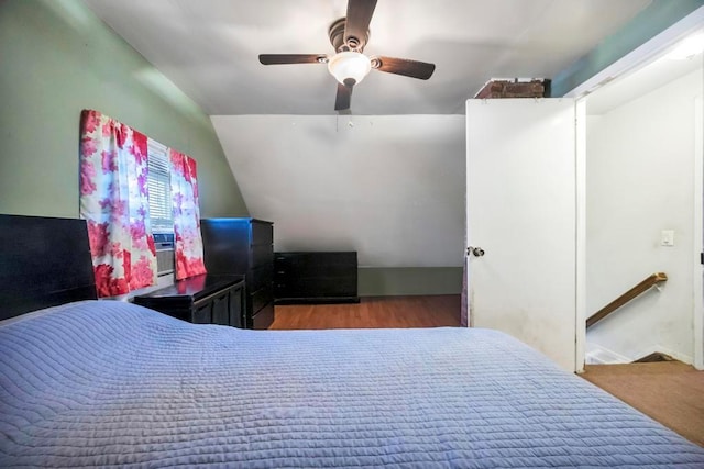 bedroom with ceiling fan, lofted ceiling, and light hardwood / wood-style flooring