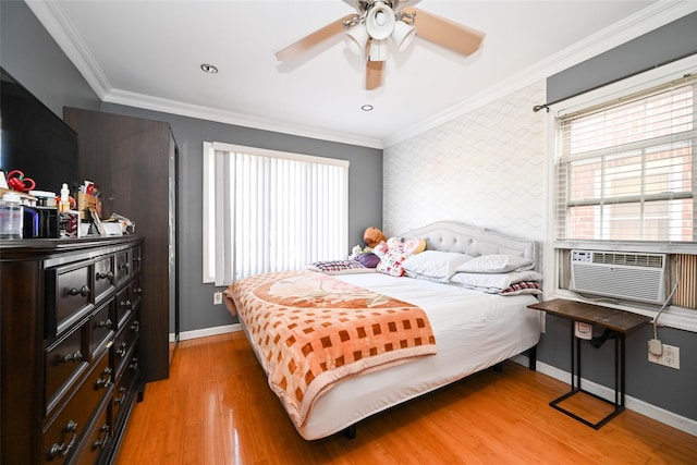 bedroom featuring ceiling fan, wood-type flooring, and ornamental molding