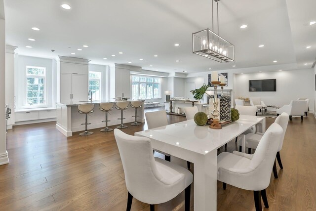 2 Weaver St Unit 3, Scarsdale, NY 10583 - dining area with hardwood / wood-style flooring, an inviting chandelier, a wealth of natural light, and sink