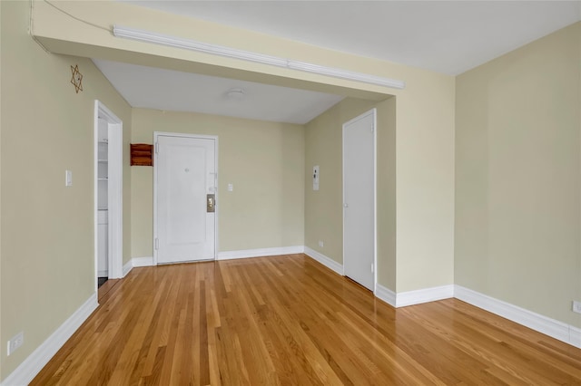 spare room featuring light wood-type flooring