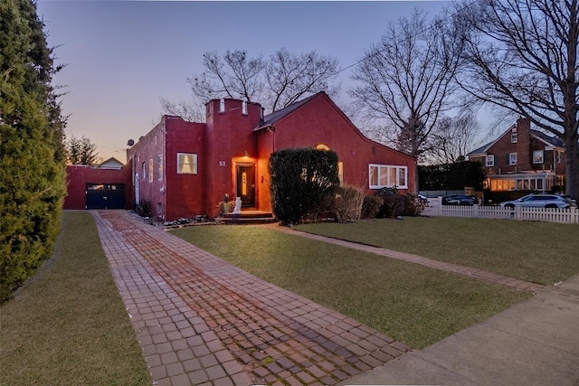 view of front of home with a lawn