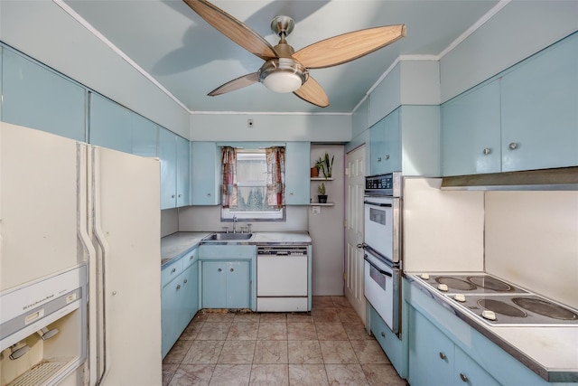 kitchen with white appliances, ceiling fan, crown molding, sink, and blue cabinetry