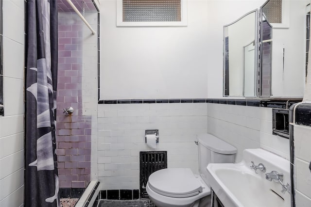 bathroom featuring a shower with curtain, sink, a baseboard radiator, tile walls, and toilet