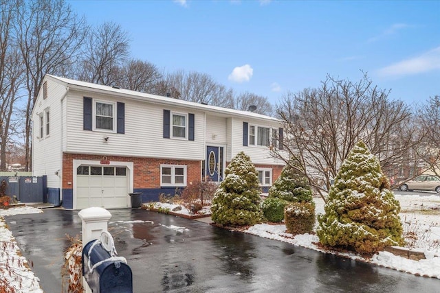 split foyer home featuring a garage