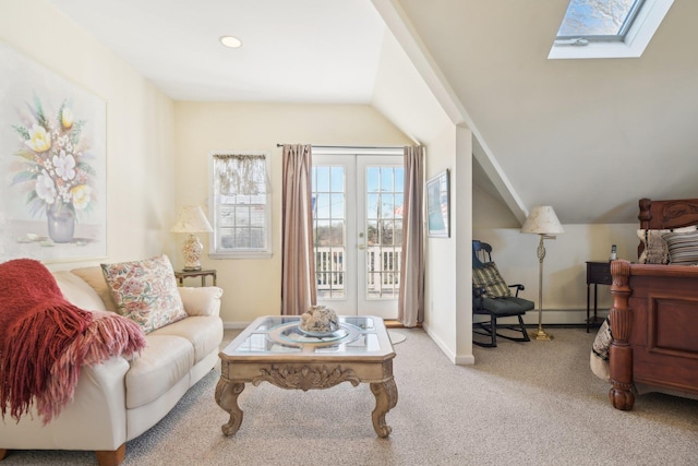 living room with light carpet and vaulted ceiling with skylight