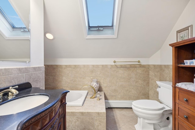 bathroom featuring vanity, a baseboard heating unit, tile patterned flooring, toilet, and a bathing tub