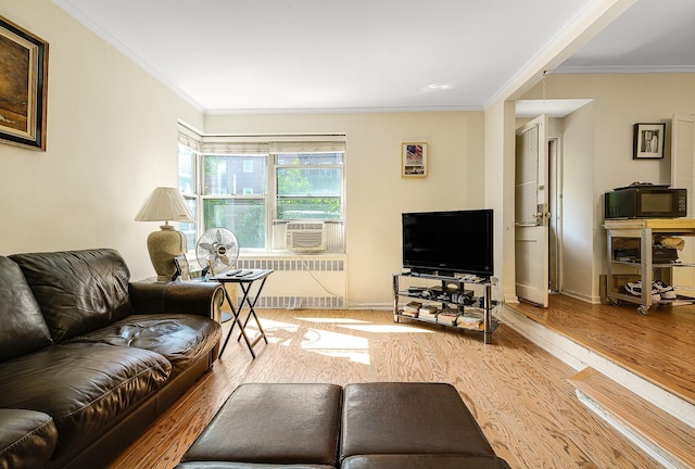 living room featuring crown molding, radiator heating unit, cooling unit, and hardwood / wood-style floors