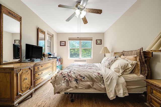 bedroom with ceiling fan and wood-type flooring