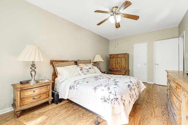 bedroom featuring ceiling fan and hardwood / wood-style flooring