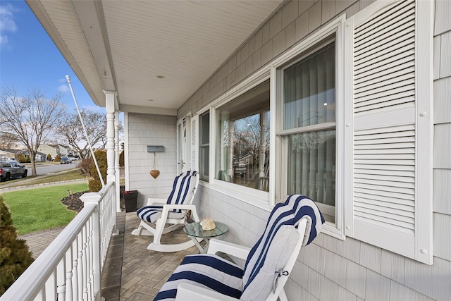 balcony featuring a porch