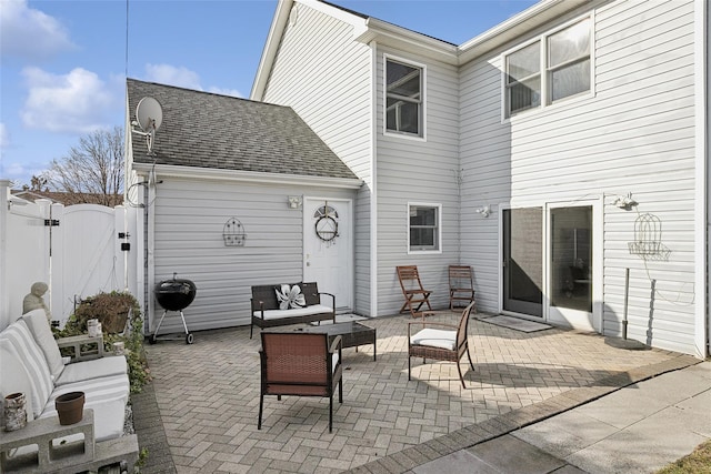 rear view of property featuring a patio and an outdoor hangout area