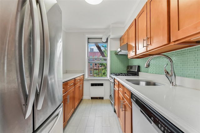 kitchen with stainless steel appliances, tasteful backsplash, and sink