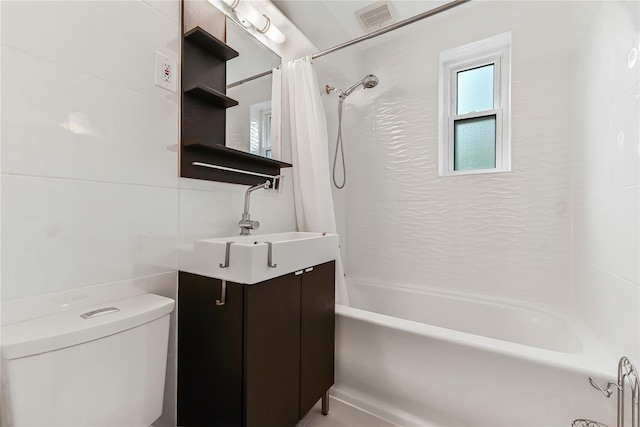 full bathroom featuring toilet, shower / tub combo, and vanity