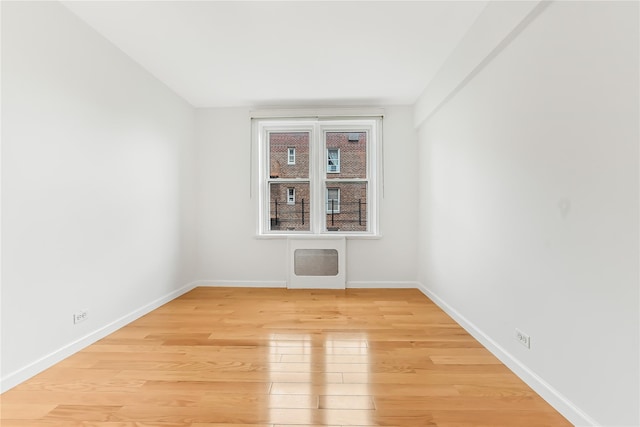 unfurnished room featuring light hardwood / wood-style flooring