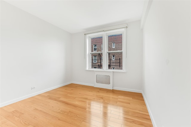 empty room featuring hardwood / wood-style floors