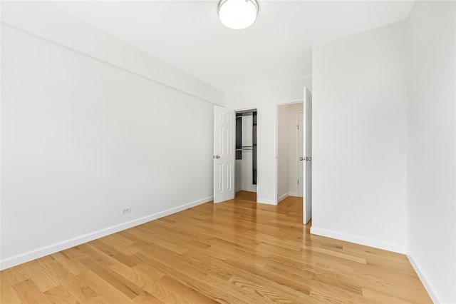 unfurnished room featuring hardwood / wood-style flooring