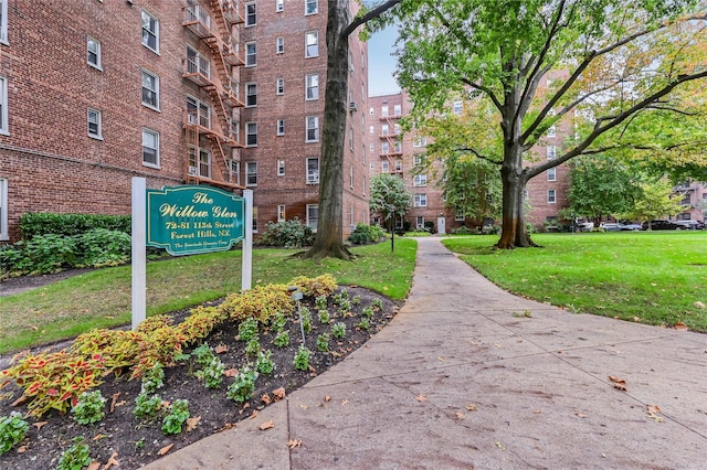 view of home's community with a yard