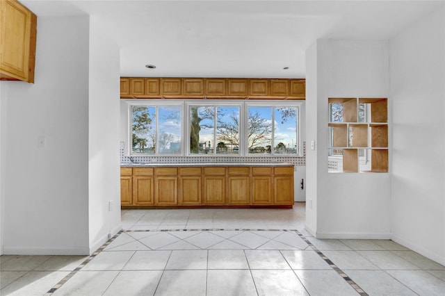 kitchen with light tile patterned floors