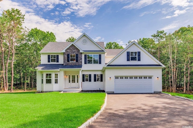 view of front facade featuring a front lawn and a garage