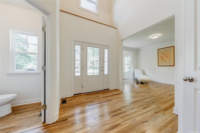 foyer with light hardwood / wood-style flooring