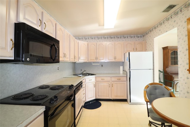 kitchen with sink and black appliances