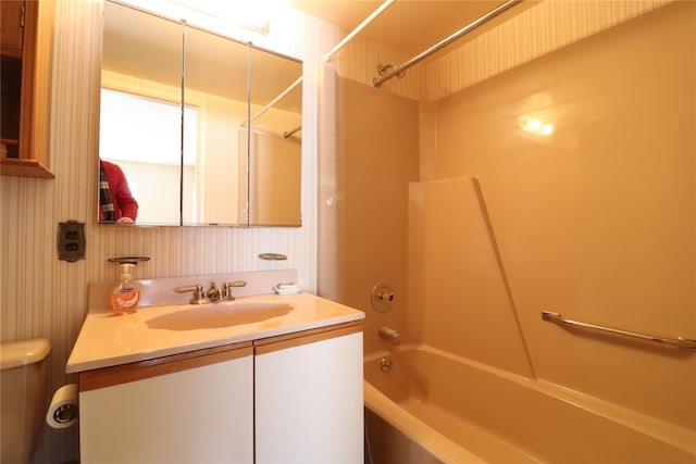 full bathroom with vanity,  shower combination, and toilet