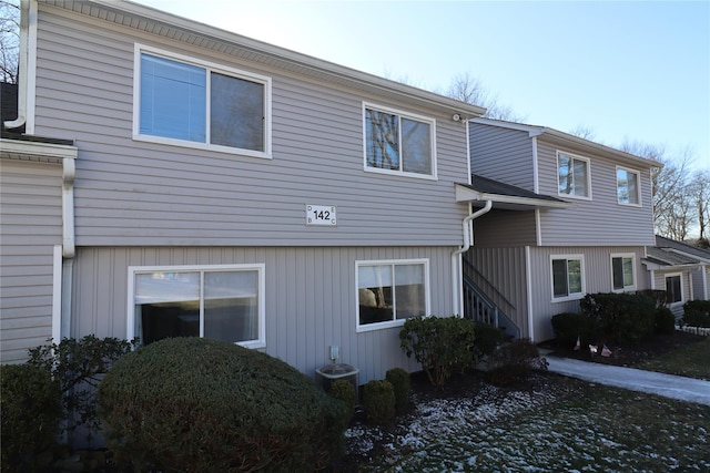 view of side of home featuring cooling unit