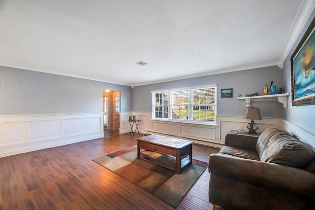 living room featuring crown molding, dark hardwood / wood-style flooring, and a baseboard radiator