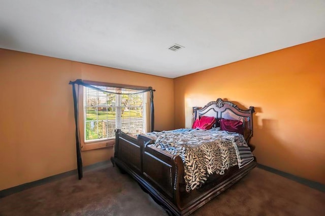 bedroom with dark carpet