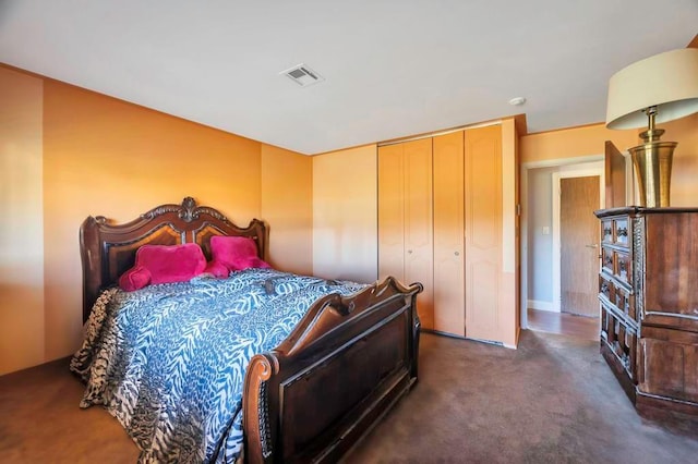 carpeted bedroom featuring a closet