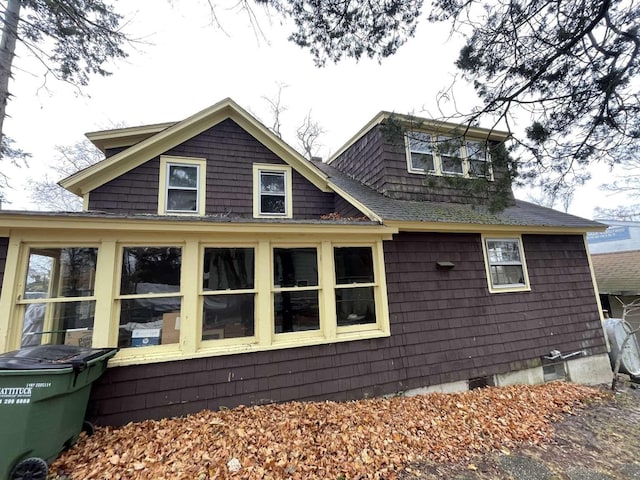 view of side of home featuring a sunroom