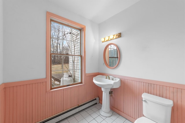 bathroom featuring toilet, tile patterned floors, and baseboard heating