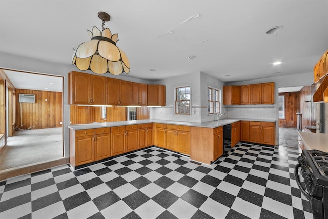 kitchen with kitchen peninsula, black gas stove, tasteful backsplash, wine cooler, and sink