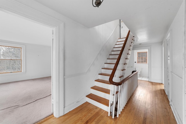 stairway featuring hardwood / wood-style flooring