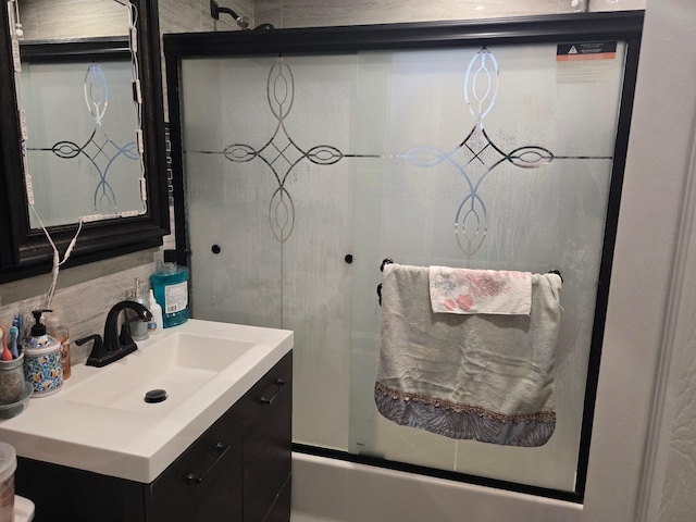 bathroom with decorative backsplash and vanity