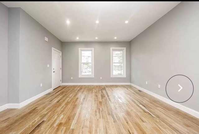 spare room with light hardwood / wood-style flooring