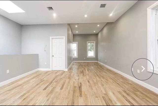 spare room with light wood-type flooring