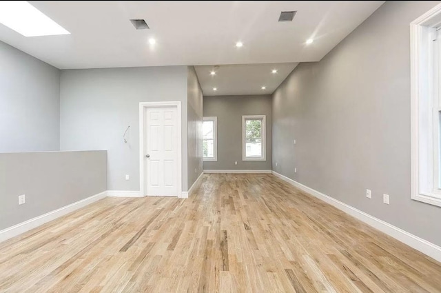 unfurnished room featuring light hardwood / wood-style flooring